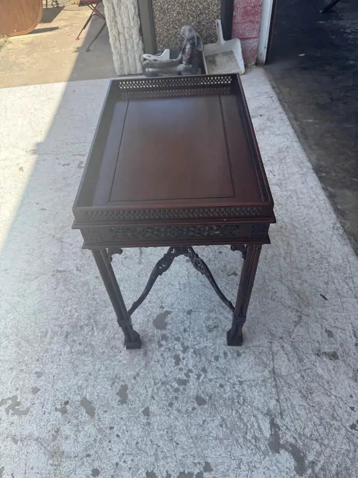 Vintage wood side table with classic Chippendale craftsmanship