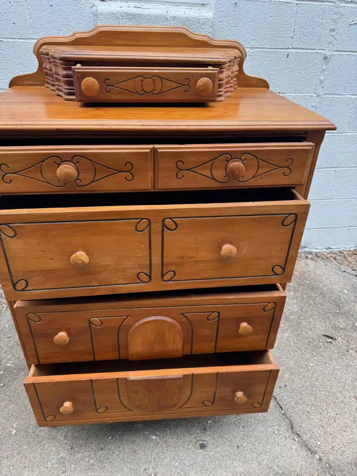 Vintage storage dresser with traditional wood grain finish