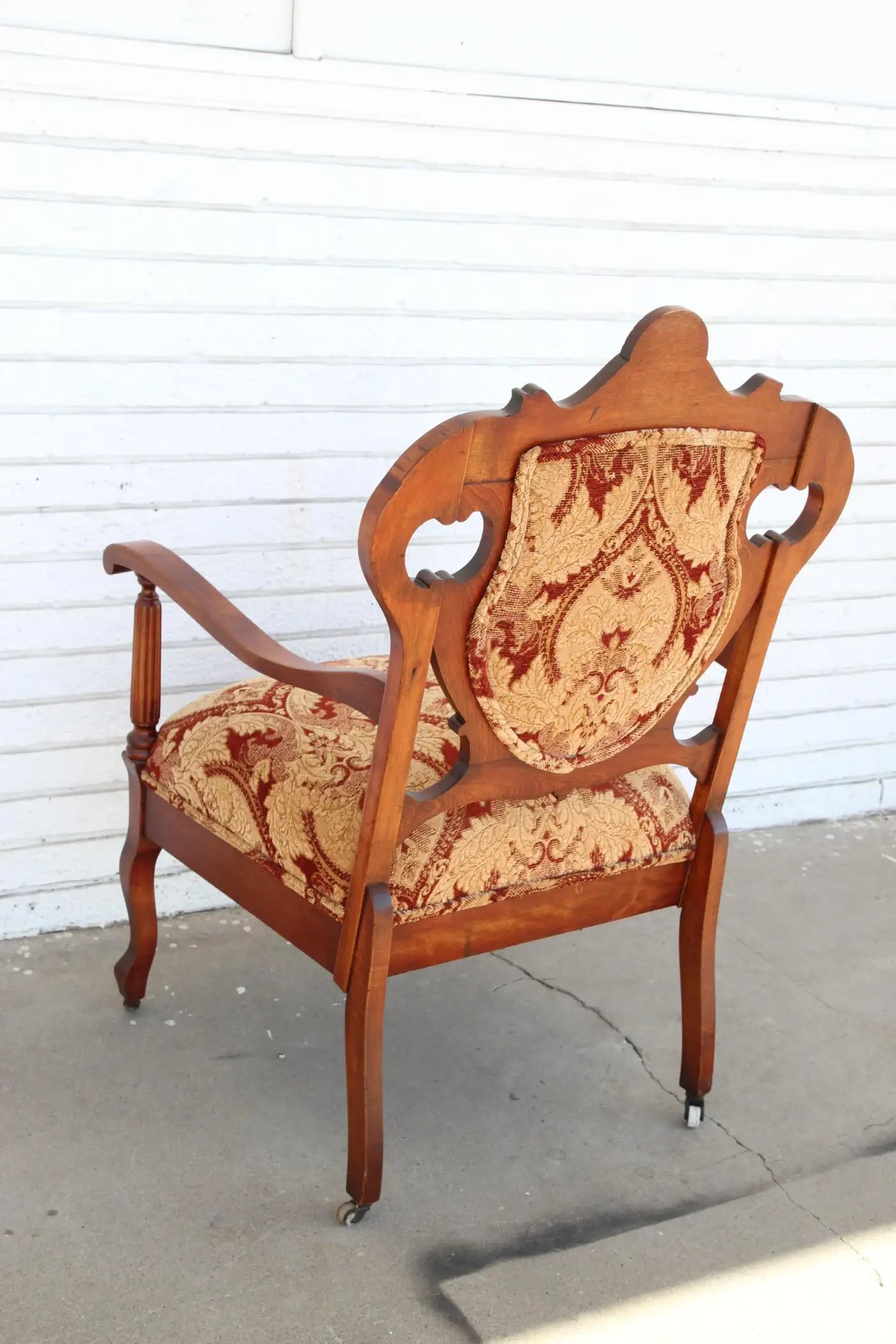 Antique Armchair with upholstery on casters