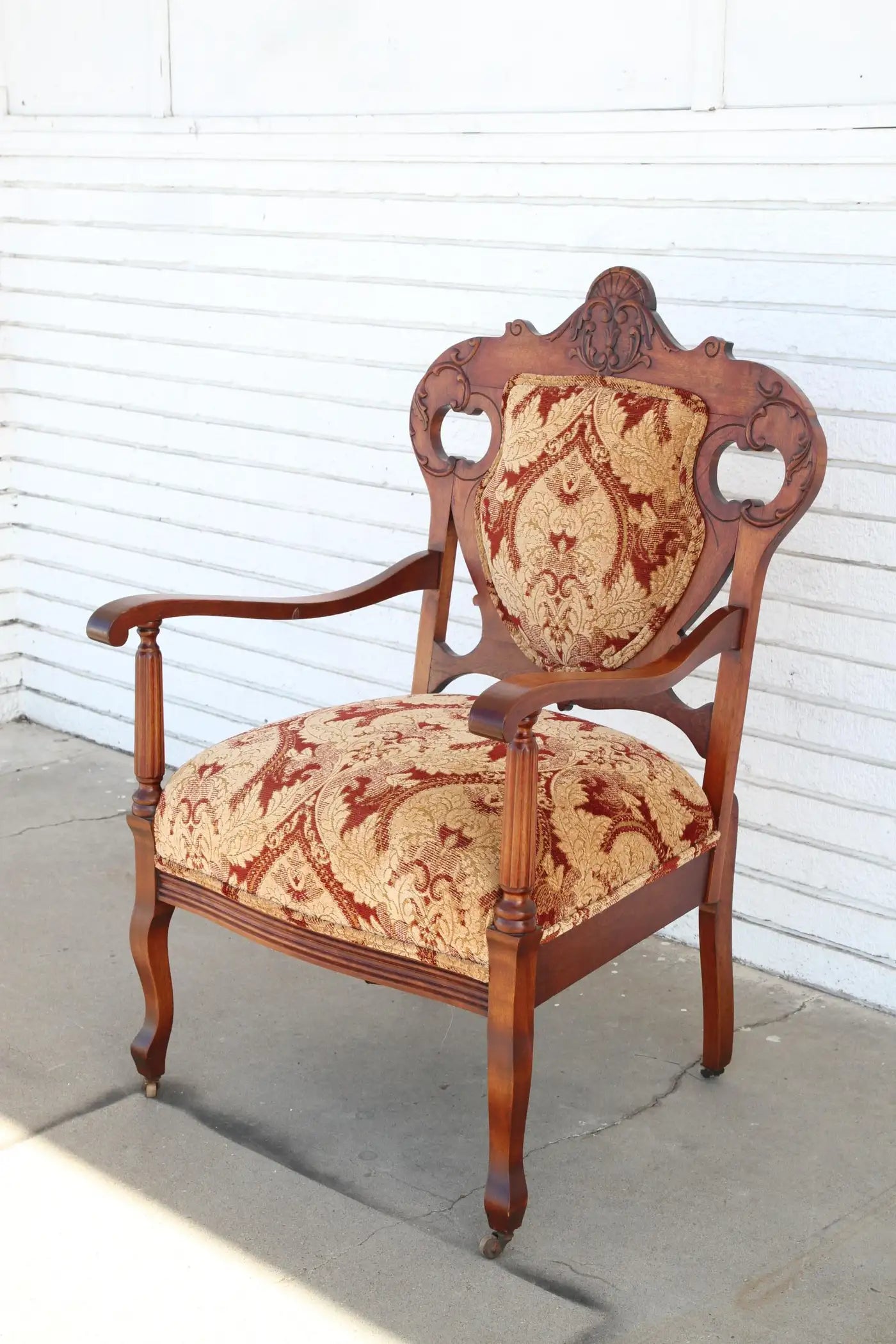 Antique Armchair with upholstery on casters