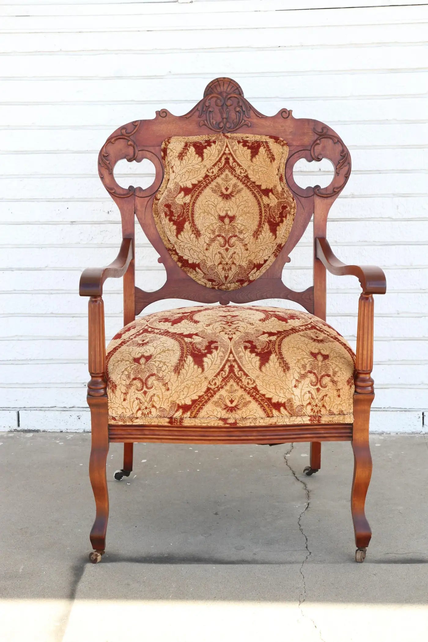 Antique Armchair with upholstery on casters