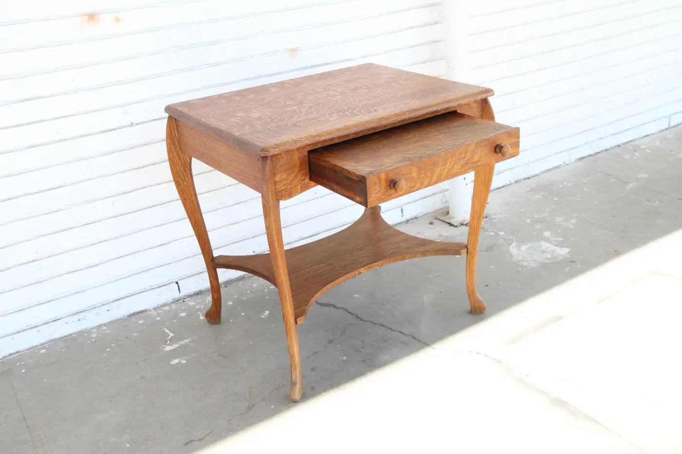 Antique Davis-Birely writing desk with detailed legs