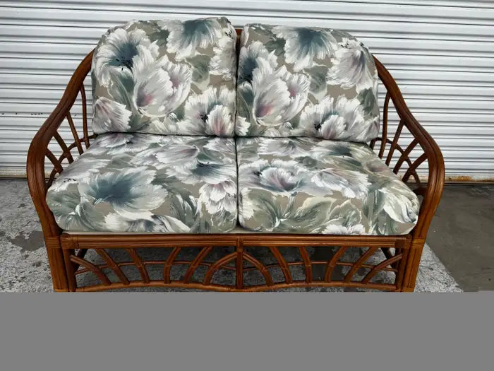 Handwoven rattan loveseat with curved arms