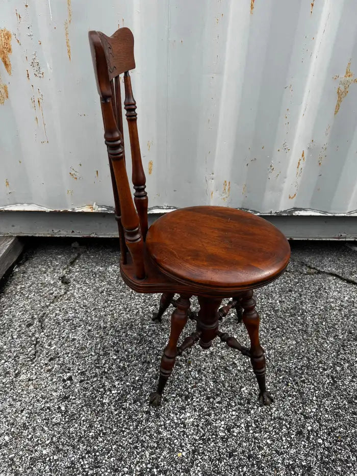 19th century walnut piano stool featuring spindle back and white marble seat