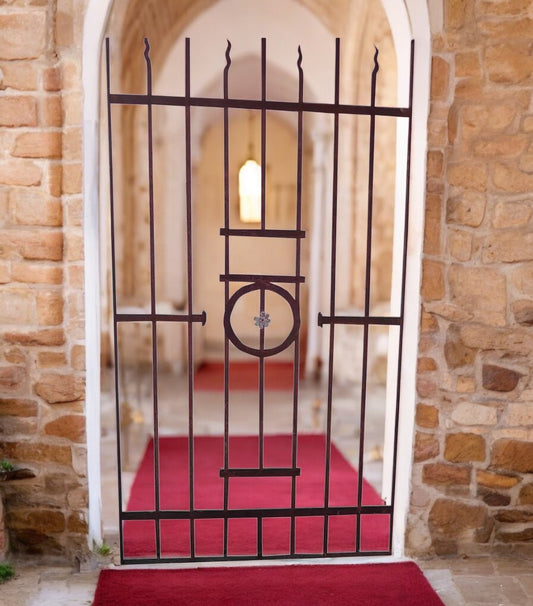 Vintage architectural gate with ornate ironwork design