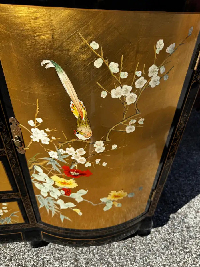 Antique style storage cabinet gold accents black lacquer finish