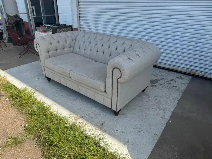 Vintage-inspired button tufted loveseat with elegant styling