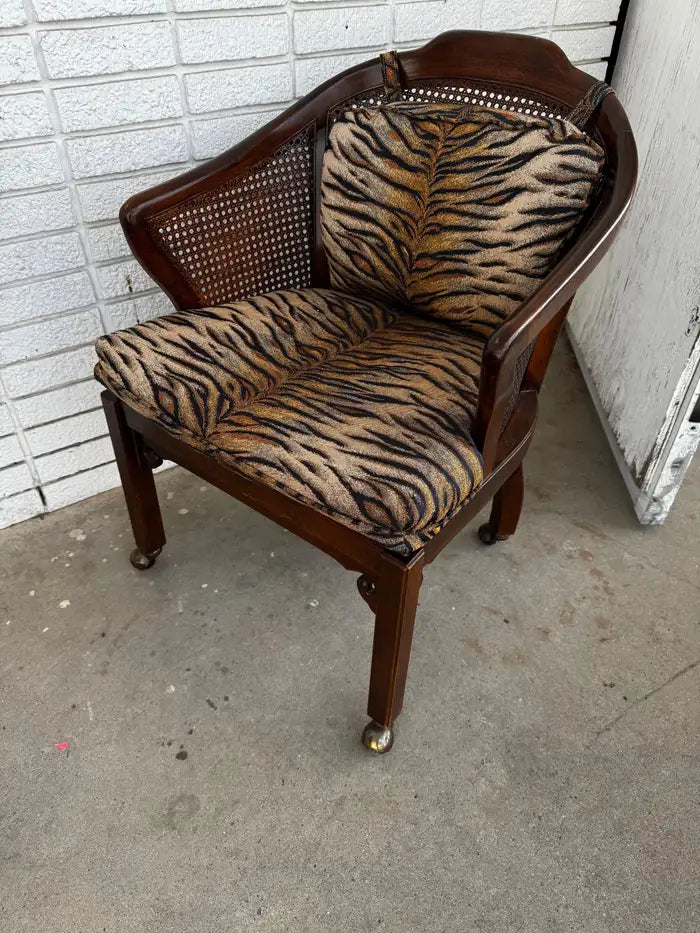 Vintage accent chair with cane seat and rolling casters
