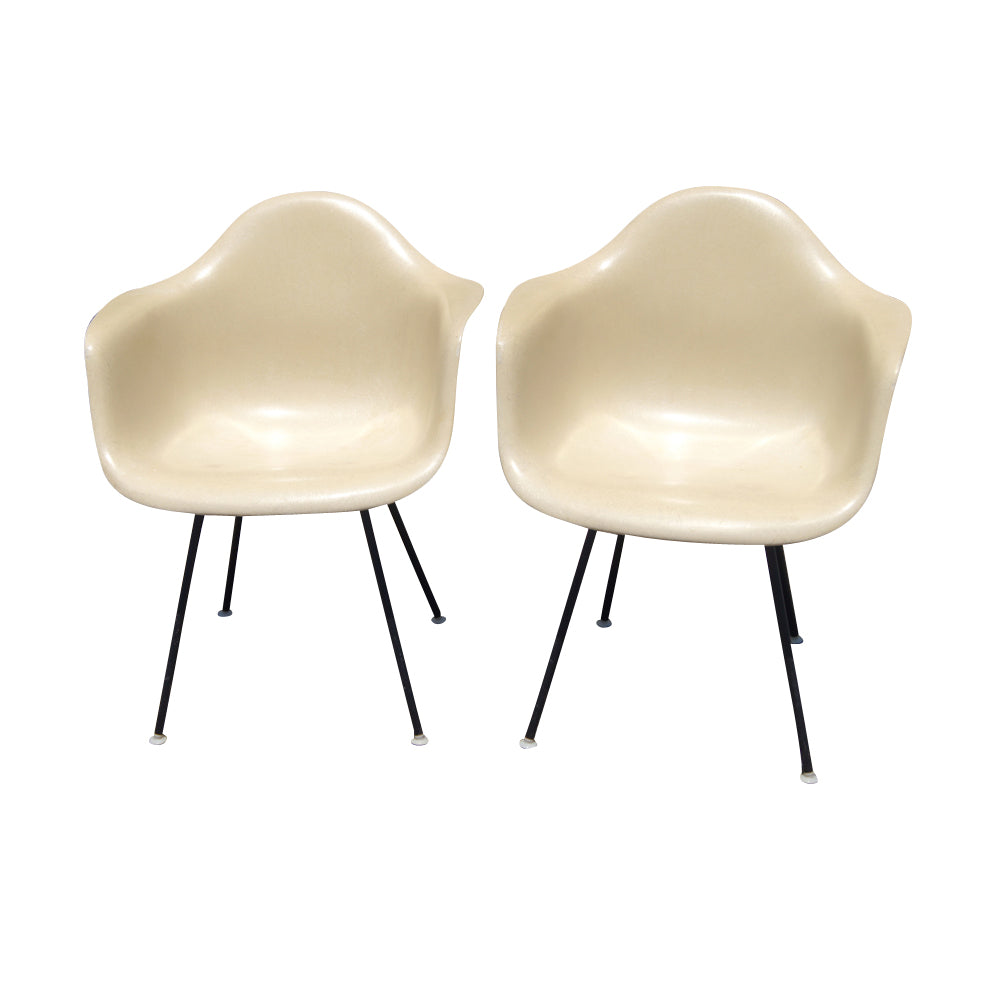Eames fiberglass arm shell chair with metal legs