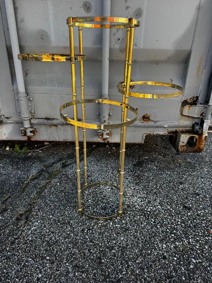 Faux bamboo gold metal shelving unit