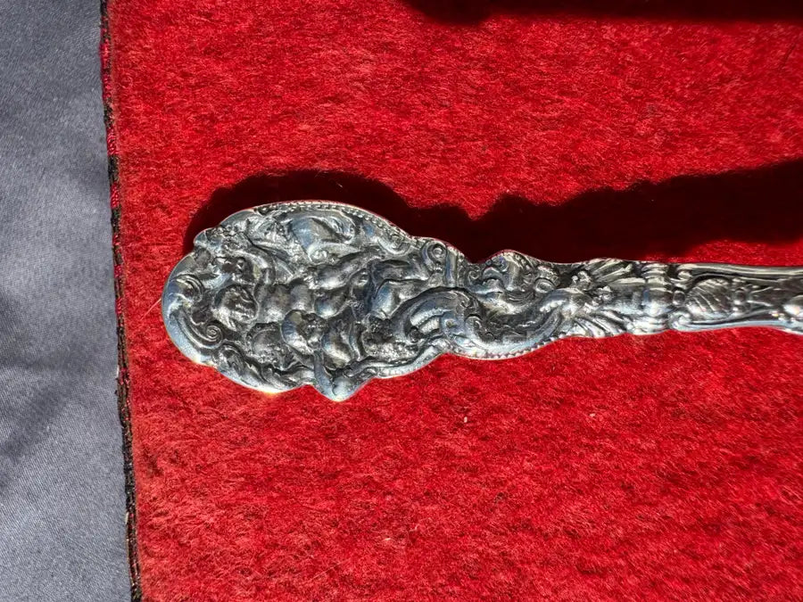 vintage sterling silver utensil with decorative handle
