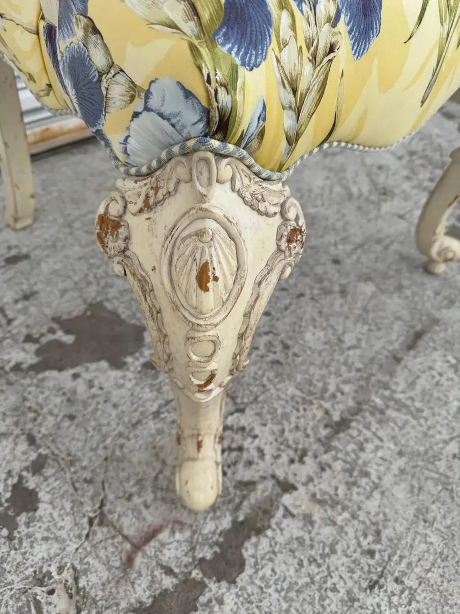 Vintage French accent chair with detailed wood carving and fabric seat