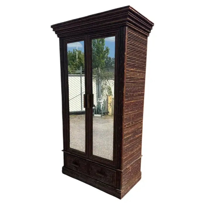 Vintage mirrored armoire with decorative wood frame