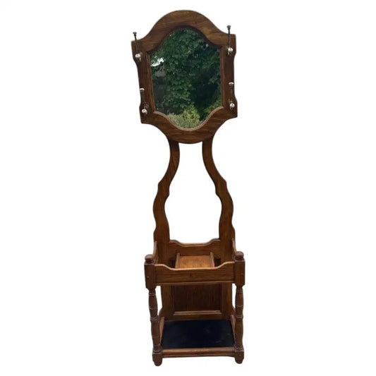 Vintage oak entryway hall tree with carved wood craftsmanship