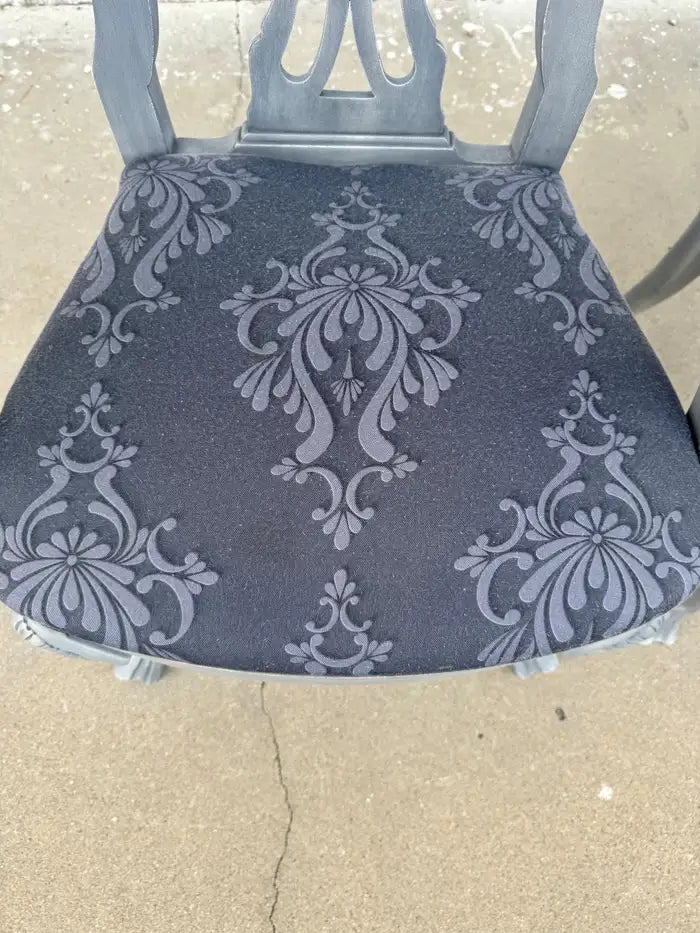 Elegant gray upholstered armchairs with cabriole legs