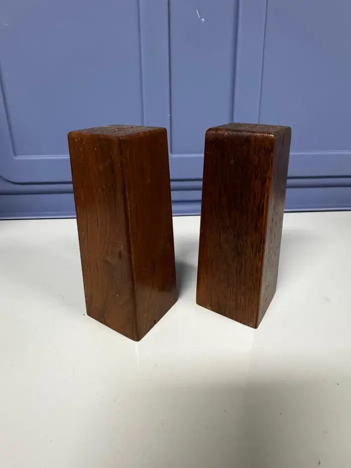 Modern wooden salt and pepper shakers on marble