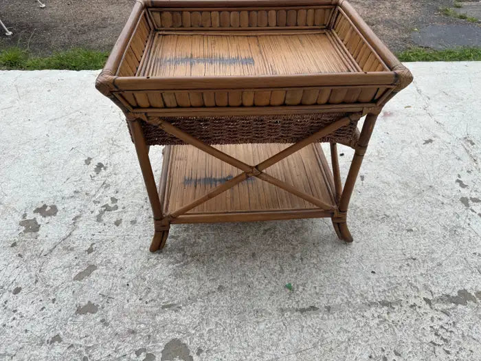Tropical inspired wicker accent furniture piece
