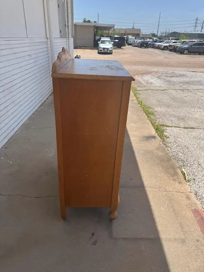 Vintage wooden dresser with four spacious storage drawers