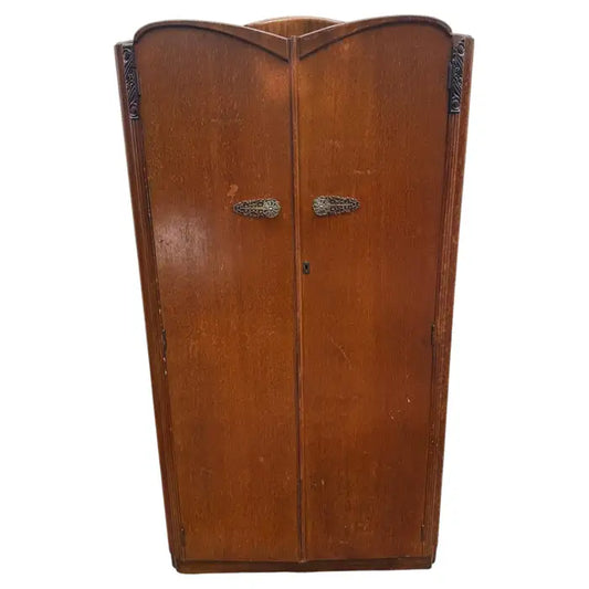 Vintage gentlemen wardrobe armoire with classic wood craftsmanship