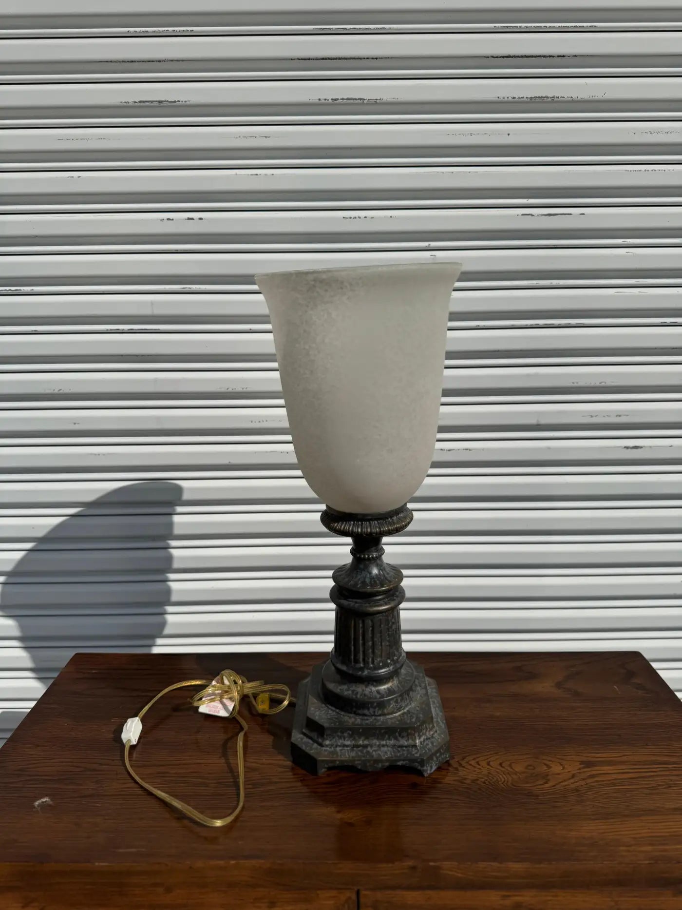 Elegant table top lamp with frosted glass shade and decorative patterns
