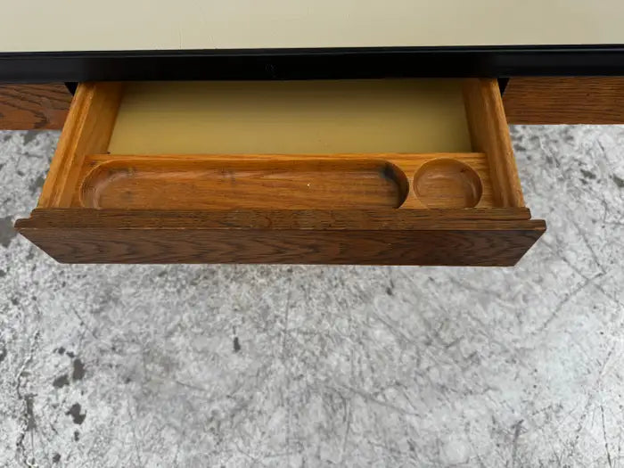 Mid century modern desk photographed on marble surface