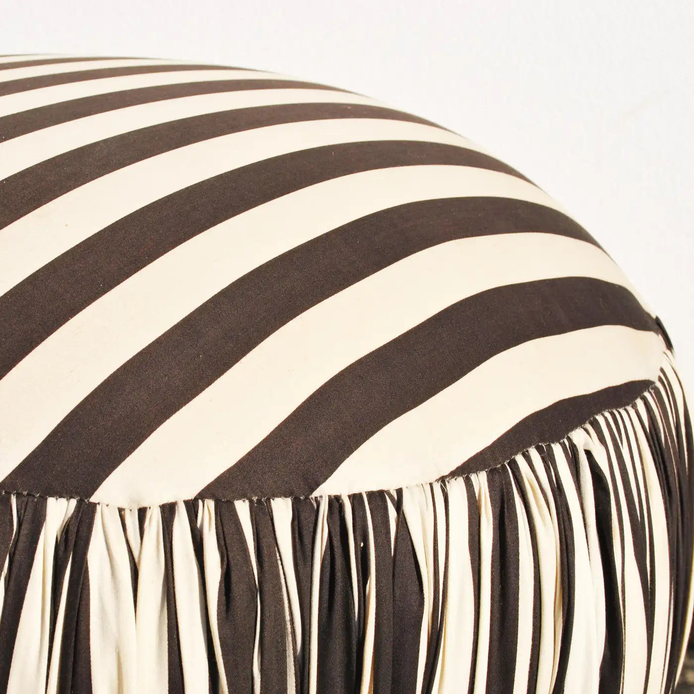 Modern round black and white pouf ottoman for versatile spaces