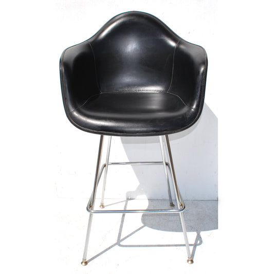 Black Eames Vinyl Fiberglass Bar Stool from Herman Miller. Explore the perfect blend of style and comfort in this iconic mid-century modern piece.