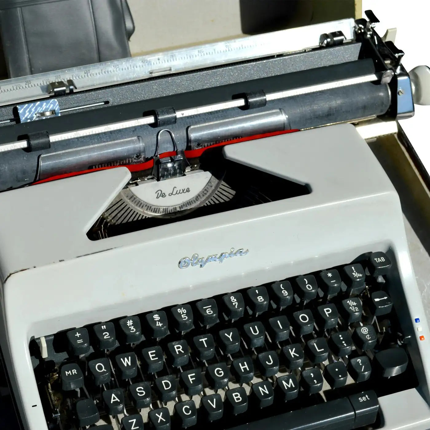 Vintage Olympia De Luxe Portable Typewriter with Carrying Case