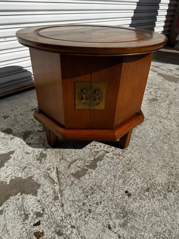 hexagonal walnut cabinet with round top design