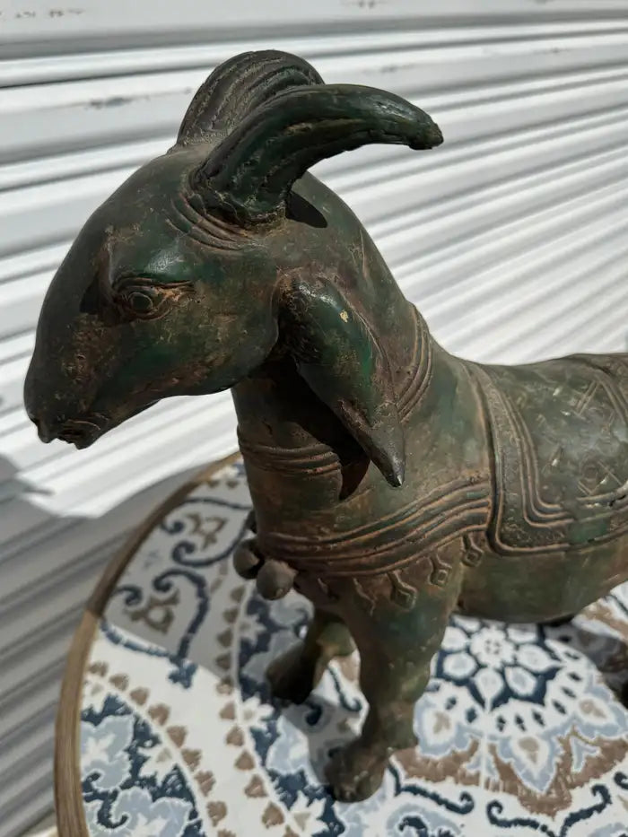 bronze goat statue with aged patina finish