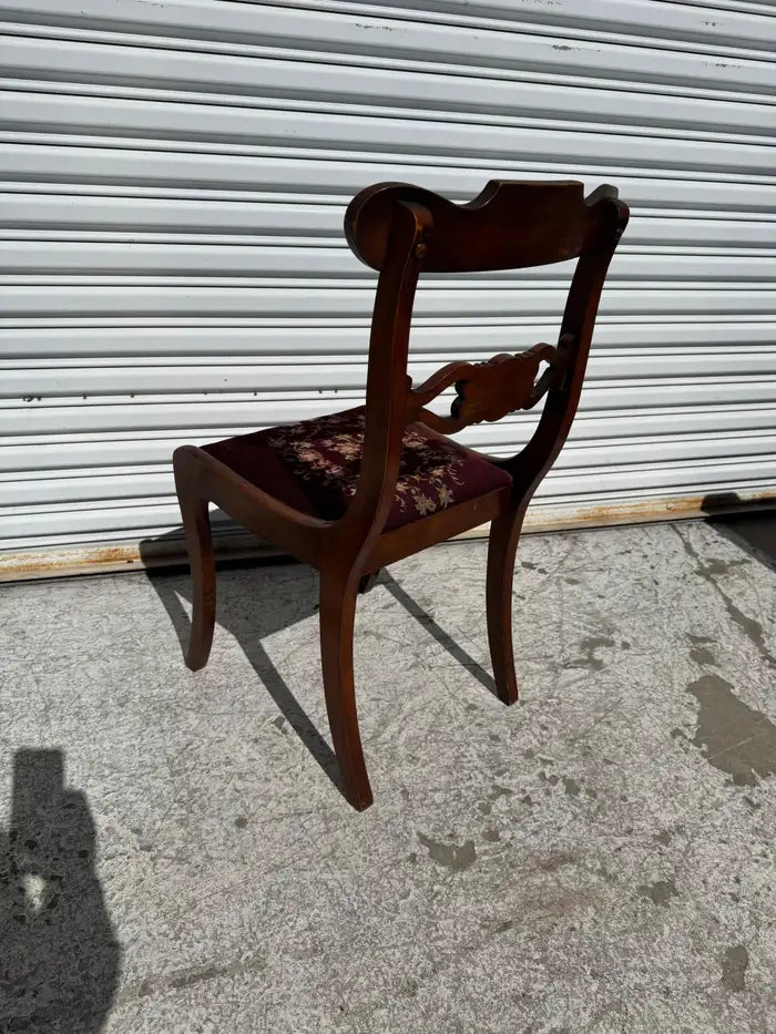traditional mahogany chair with detailed carved frame