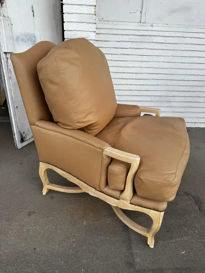 classic bergere chair with carved oak frame and leather upholstery