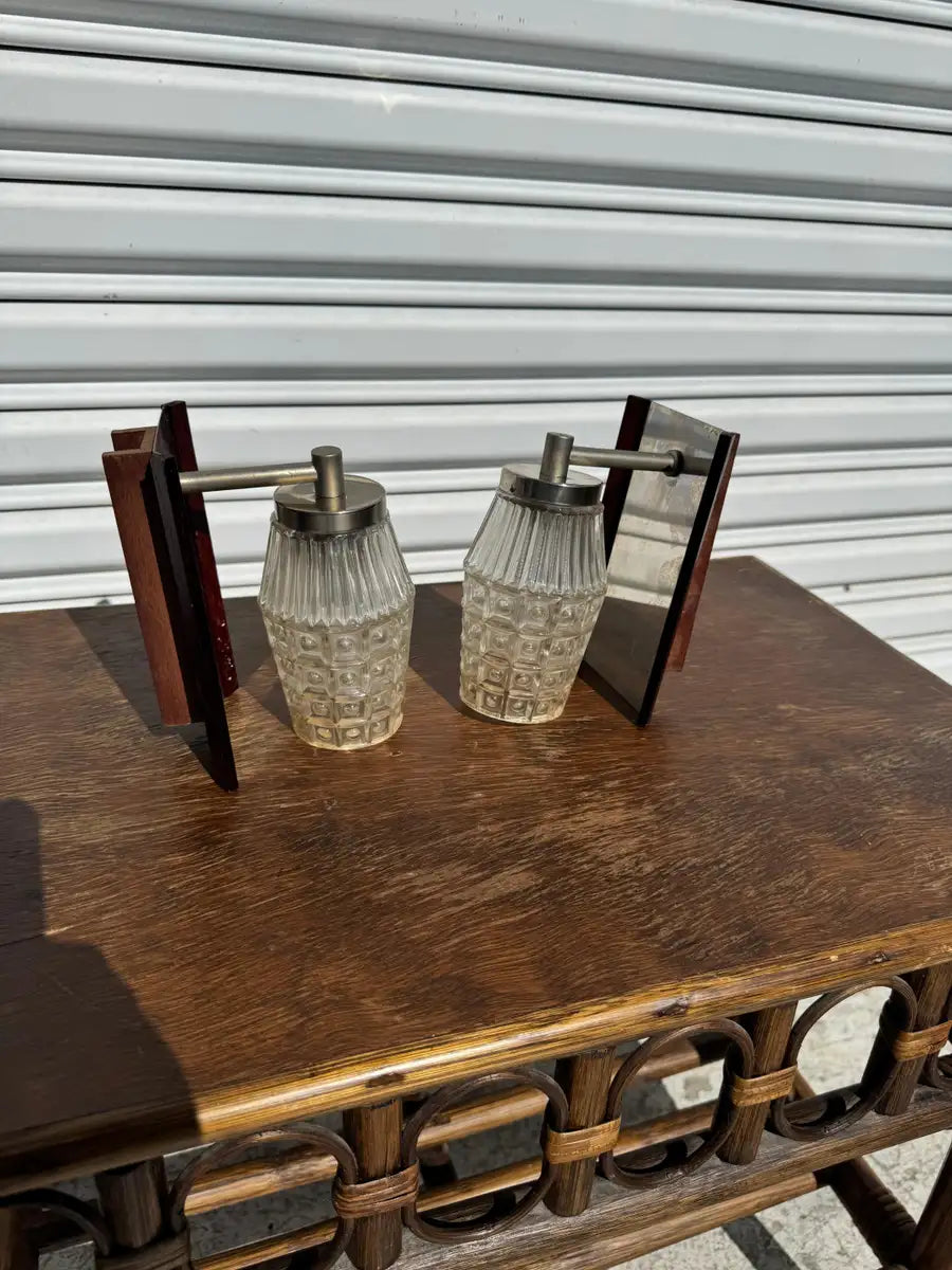 chrome wall sconces with rosewood accents lighting