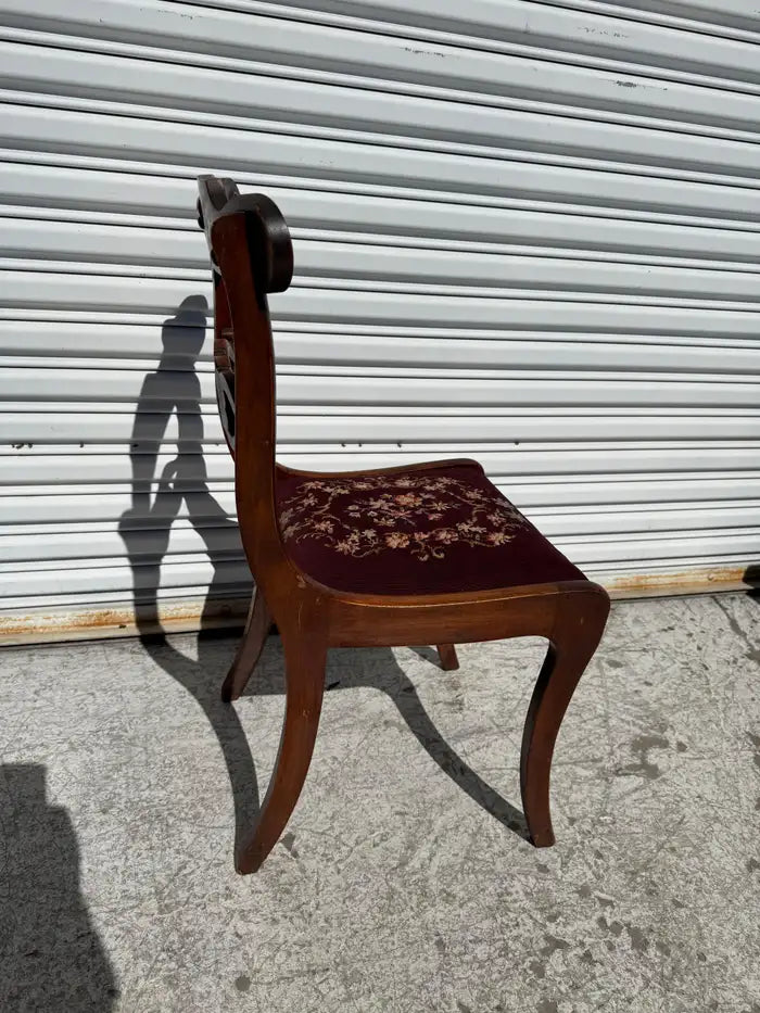 antique accent chair with floral needlepoint upholstery
