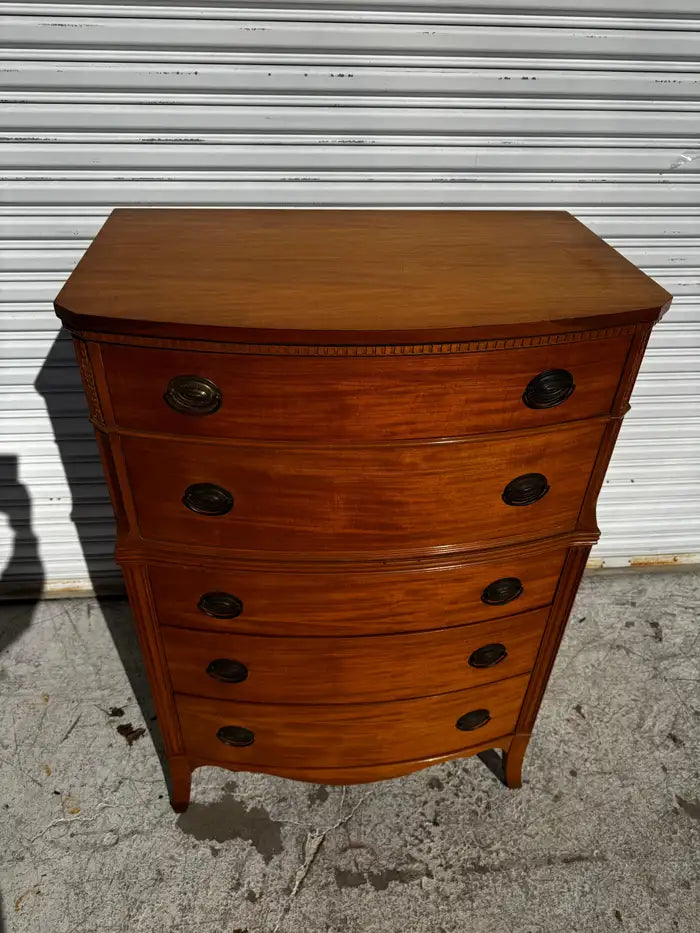elegant mahogany chest with ribbon grain wood pattern