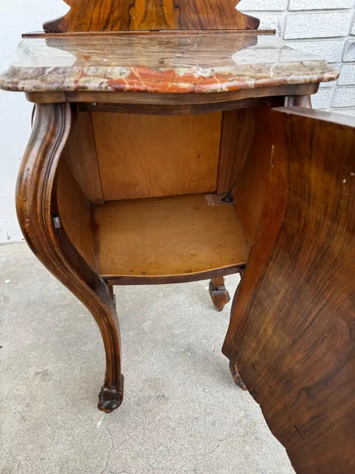 vintage wood bombe side tables with marble tops and carved details