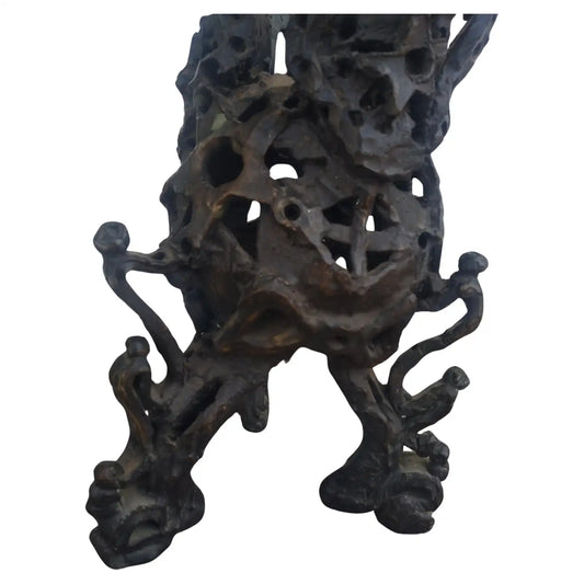 Bronze brutalist sculpture with abstract design