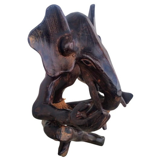 Hand carved wood elephant sculpture with detailed craftsmanship