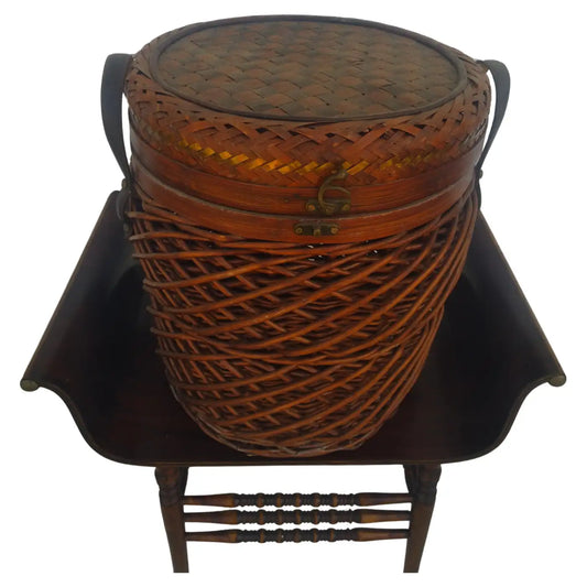 Handwoven wicker basket with detailed brass inlay