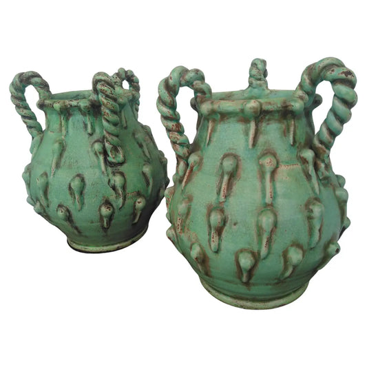 Pair of sculptural lime green vases with modern design