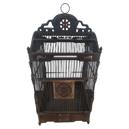 Large vintage metal bird cage with ornate design