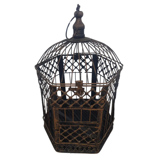 Small decorative metal bird cage with intricate design