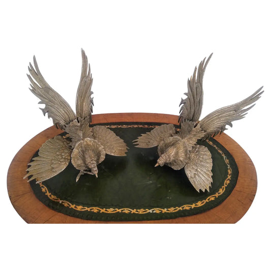 Pair of metal fighting roosters statues
