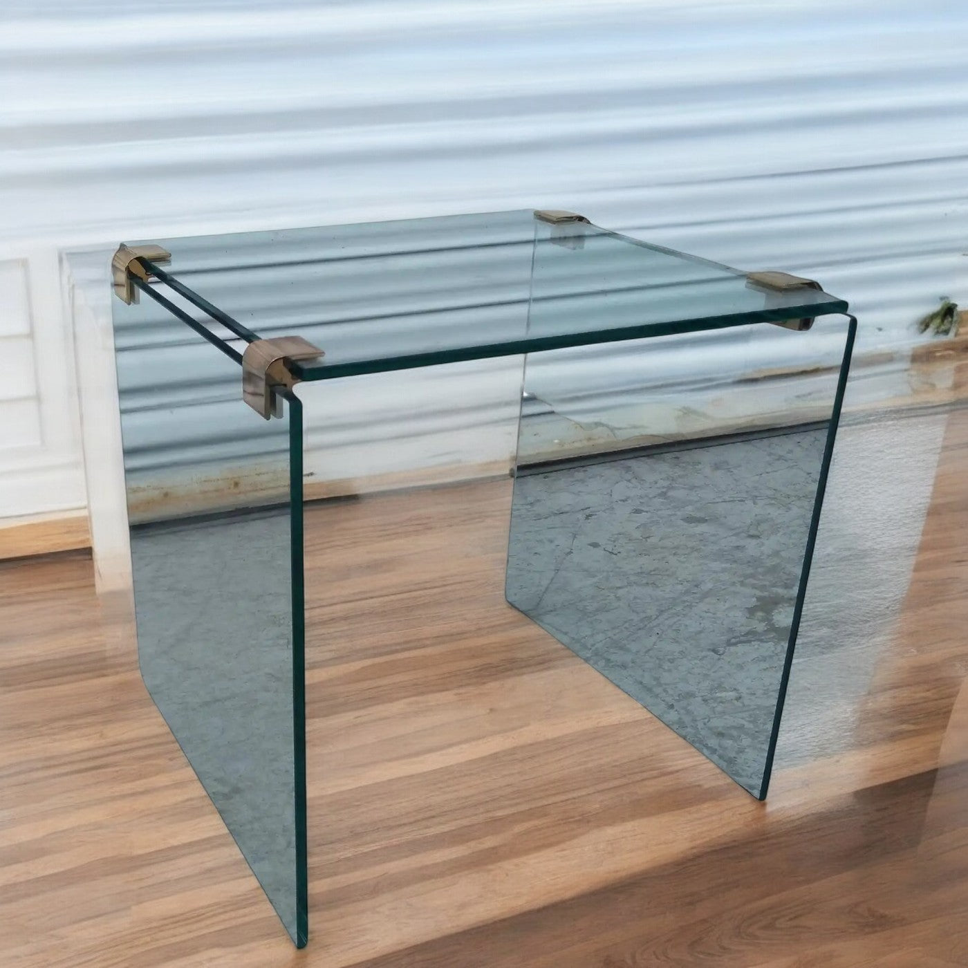 Modern glass table with brass accents