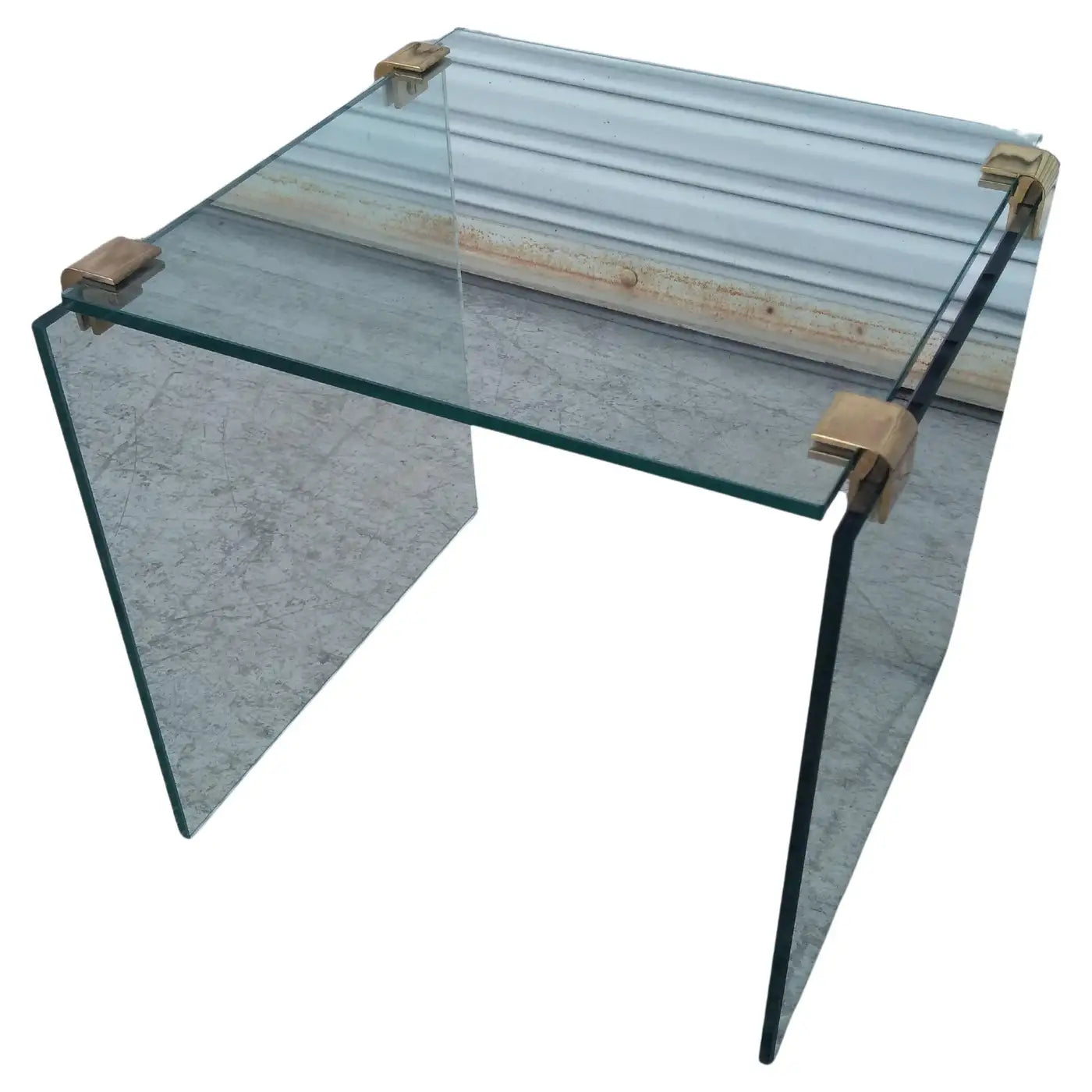 Luxury glass table with brass frame details