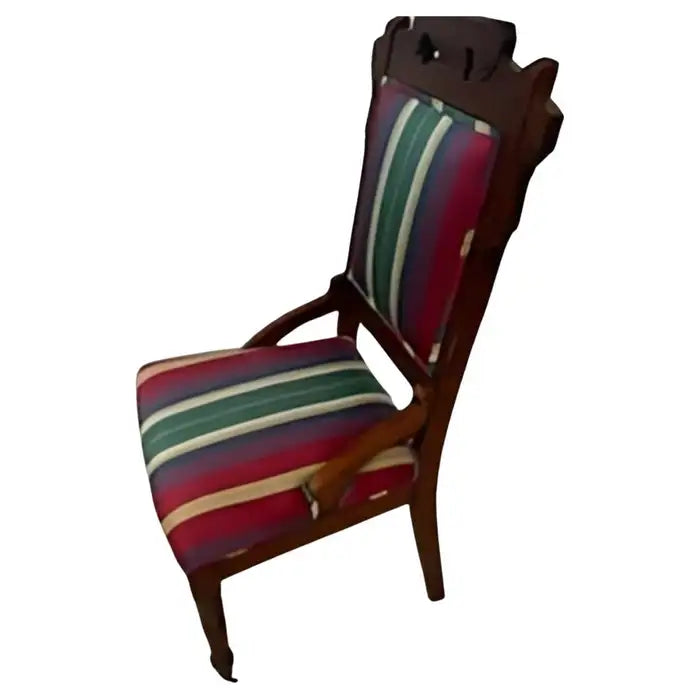 Antique Eastlake chair with casters on front legs