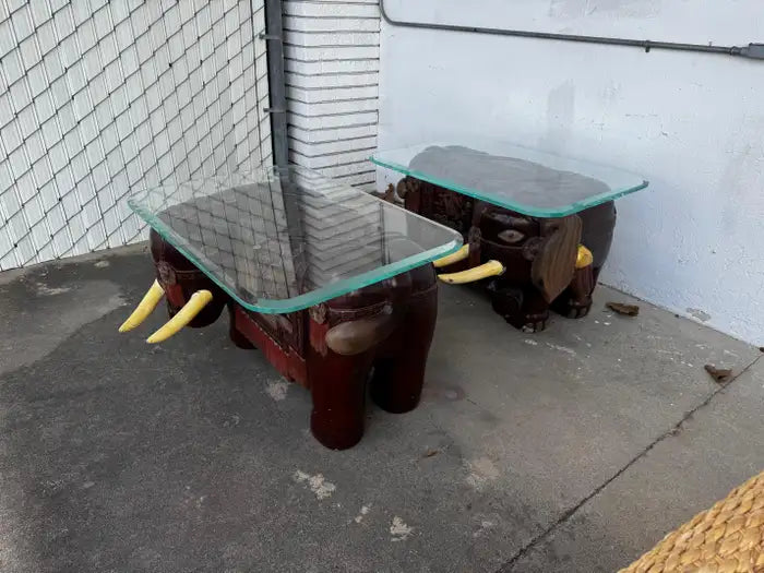 sculpted elephant accent tables with detailed tusks and glass top