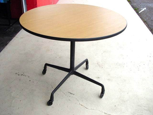 Eames Round Dining Table by Herman Miller. Explore timeless design and exceptional craftsmanship in this iconic mid-century piece, ideal for both residential and commercial settings.