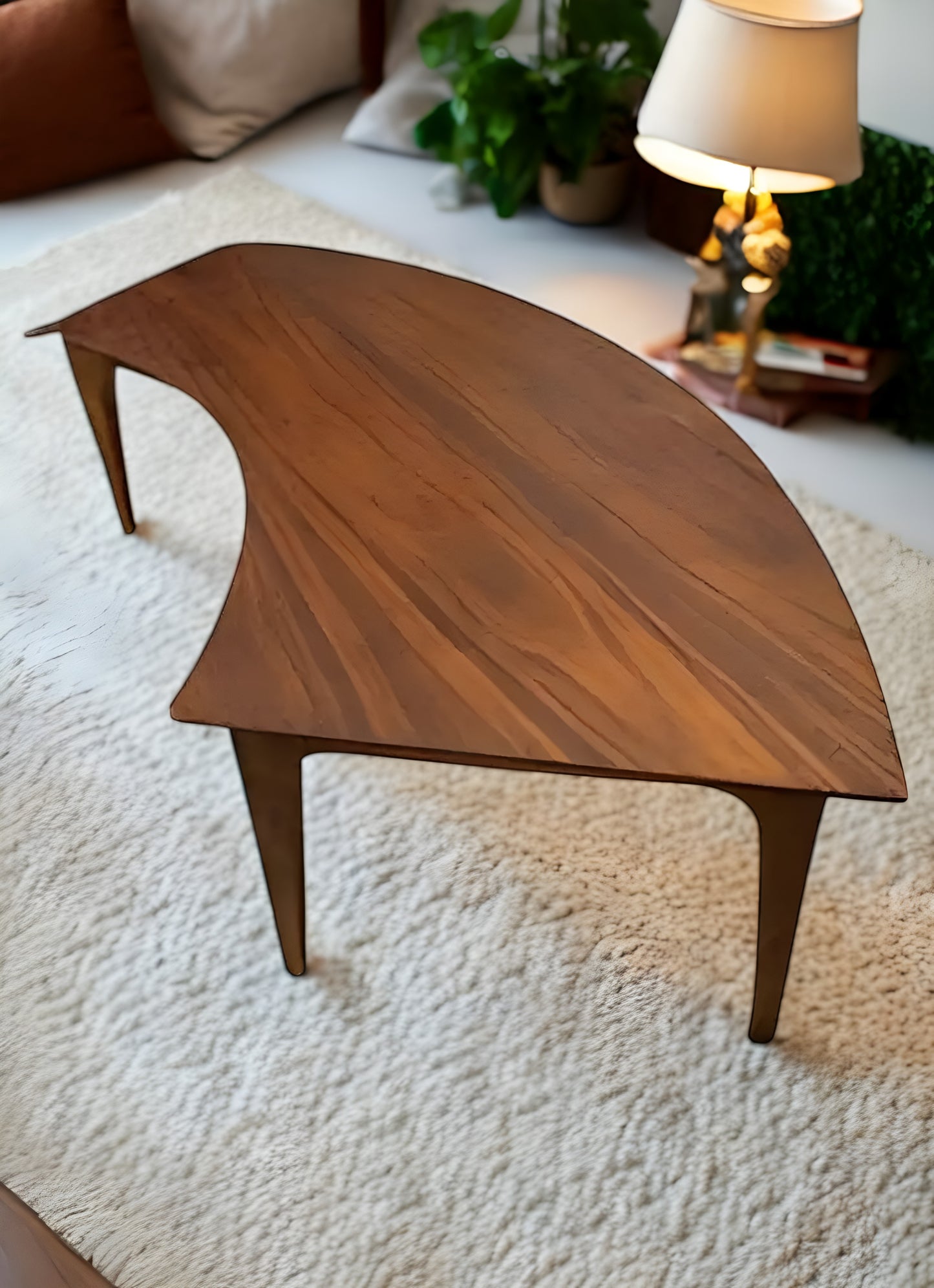 Modern curved coffee table – sleek and stylish design.
