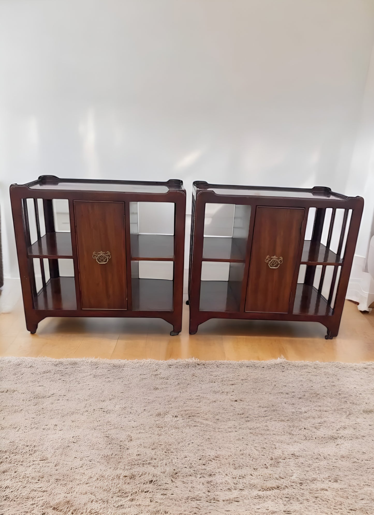 Vintage mahogany rolling side cabinets from the 20th century, perfect for mid-century decor.